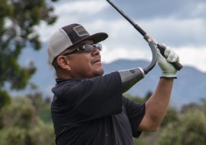 Disabled veteran participating at wounded heroes of america's annual golf tournament