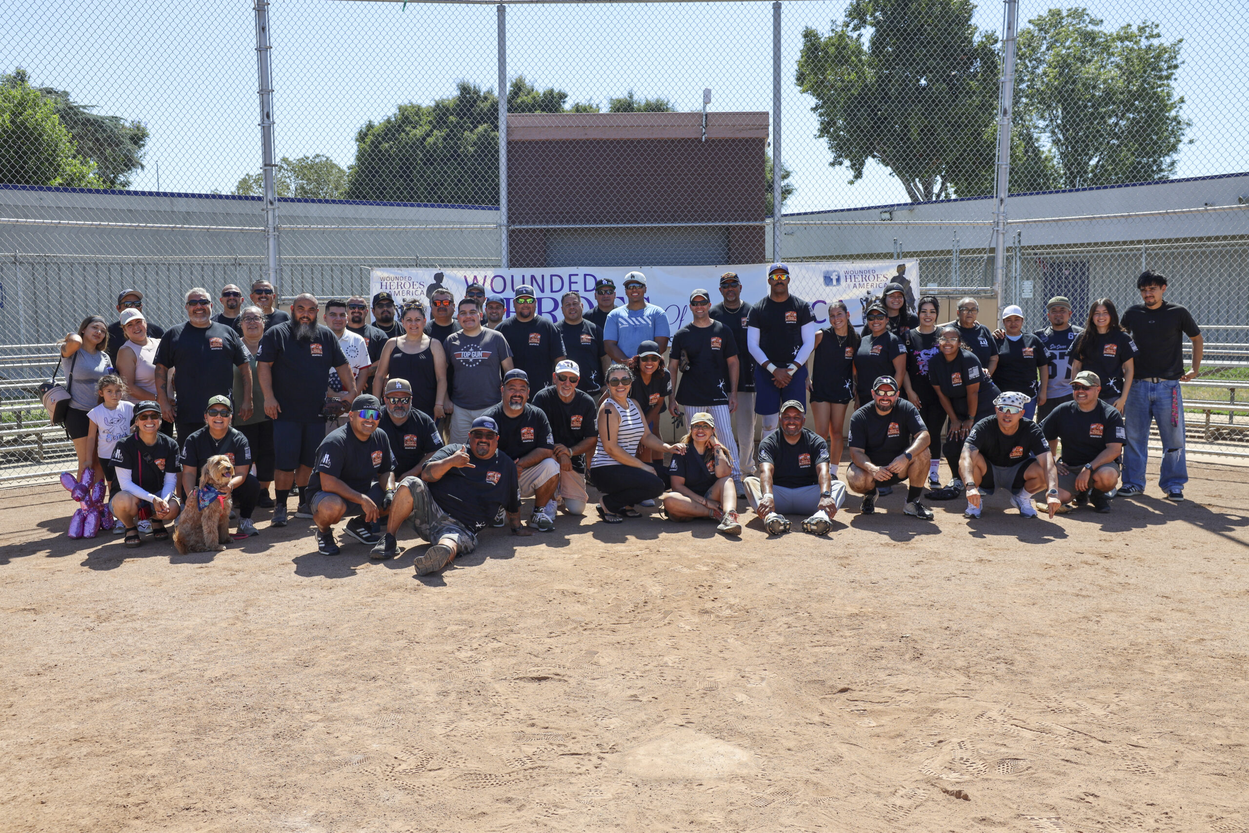players and spectators at the annual wounded heroes and san gabriel valley marines softball game