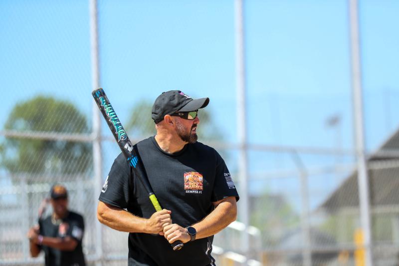 softball player practicing batting softball player practicing batting